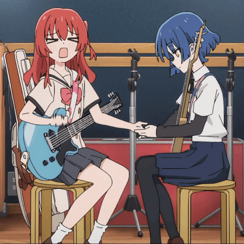 A Girl With Red Hair Is Sitting Next To A Girl With Blue Hair GIF