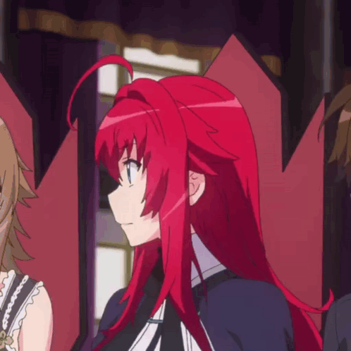 A Girl With Red Hair Is Standing In A Room With Other Girls GIF