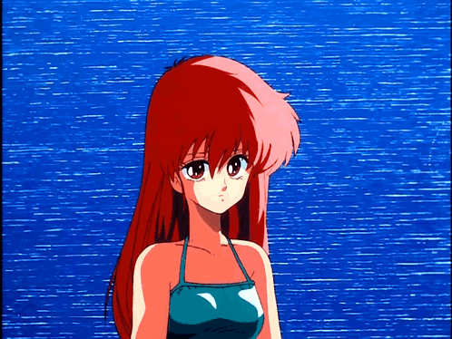 Girl With Red Hair In Front Of Blue Ocean GIF