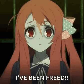 A Girl With Red Hair Is Standing In Front Of A Fence And Says `` I 'Ve Been Freed '' . GIF