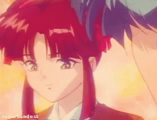 A Girl With Red Hair Is Standing Next To A Boy With Blue Hair And The Words Sugarhounddust On The Bottom GIF