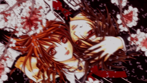 A Girl With Red Hair Is Surrounded By Flowers And Petals GIF