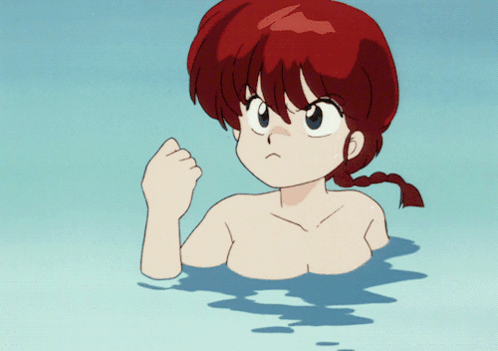 A Girl With Red Hair Is Swimming In A Pool GIF