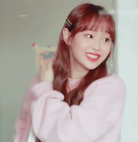A Girl With Red Hair Is Wearing A Pink Shirt GIF