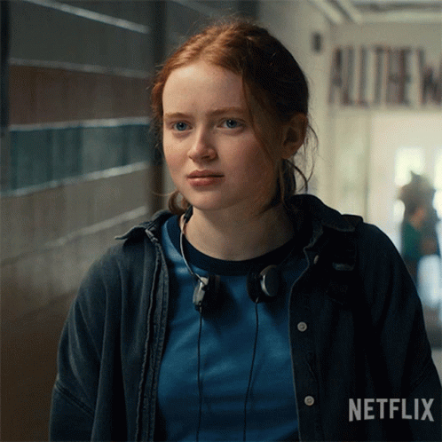 A Girl With Red Hair Is Wearing Headphones And A Netflix Logo GIF