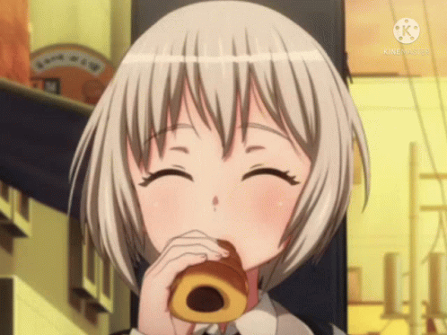a girl with short white hair is eating a donut and smiling for the camera