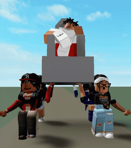 A Girl With The Letter N On Her Hat Is Holding A Large Box GIF