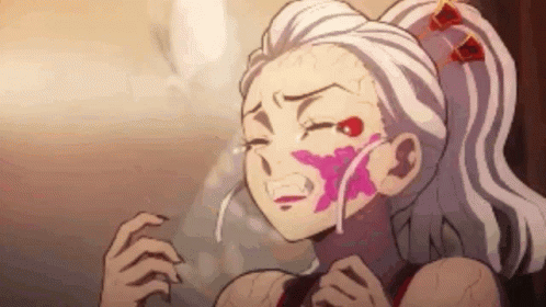 A Girl With White Hair And A Pink Flower On Her Face Is Crying In A Cartoon . GIF
