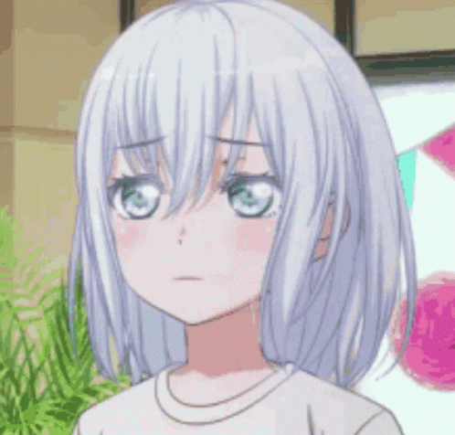 A Girl With White Hair And Pink Cheeks Is Making A Funny Face With Her Eyes Closed . GIF
