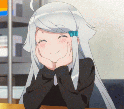 A Girl With White Hair Is Smiling With Her Hands On Her Chin GIF