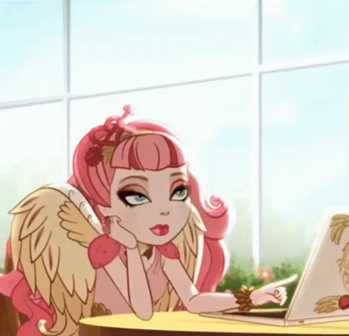A Girl With Wings Is Sitting At A Table With A Laptop And Pointing At It GIF
