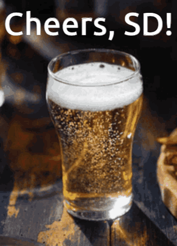 A Glass Of Beer With Cheers Sd Written On The Bottom GIF