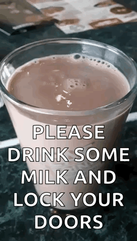 A Glass Of Milk Is On A Table With A Sign That Says Please Drink Some Milk And Lock Your Doors . GIF