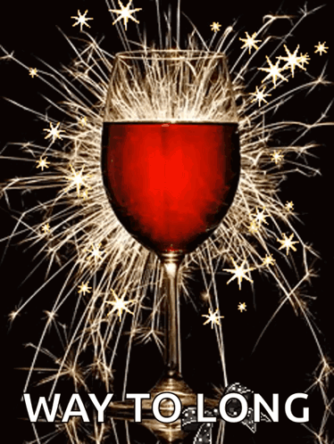 A Glass Of Red Wine Is Surrounded By Sparklers And The Words Way To Long Are Below It GIF