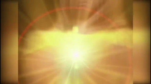 A Glowing Light Is Coming Out Of A Hole In A Wall GIF