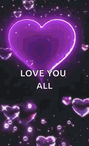 A Glowing Pink Heart With The Words `` Love You All '' Surrounded By Hearts On A Black Background . GIF