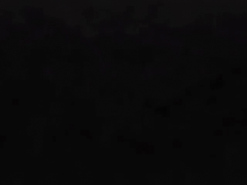 A Glowing Red Symbol On A Dark Background GIF