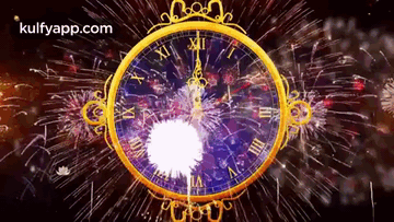 A Gold Clock With Roman Numerals And Fireworks Behind It GIF
