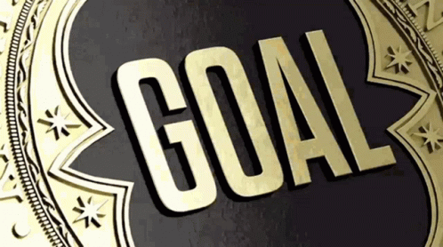 A Gold Medal With The Word Goal Written Inside Of It GIF