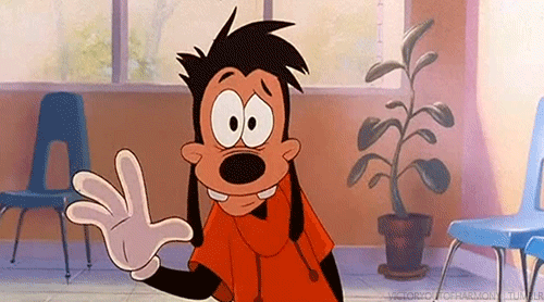 A Goofy Cartoon Character Is Waving His Hand In A Room With Chairs . GIF