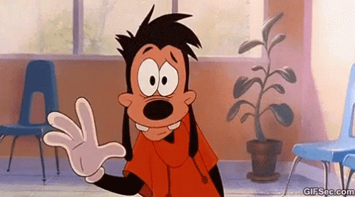A Goofy Cartoon Character Is Waving His Hand In A Room With Chairs . GIF