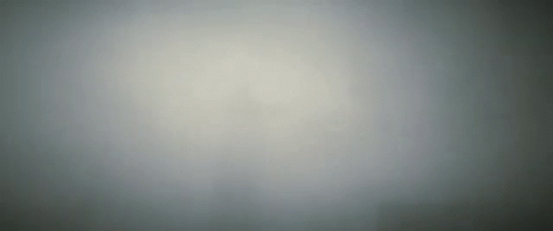 A Gray Background With A Gradient Of Light And Dark GIF