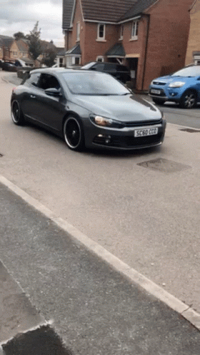 A Gray Car With A License Plate That Says Ec 50 Gpd GIF
