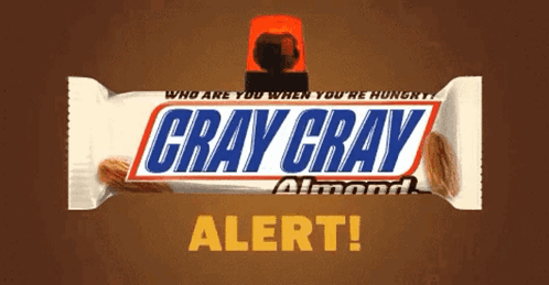 A Gray Gray Almond Snickers Bar With A Red Light On Top GIF