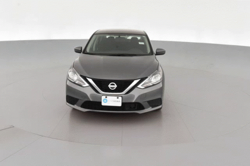 A Gray Nissan Car With A License Plate That Says Iowa On It GIF