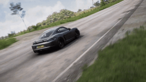 A Gray Sports Car With A License Plate That Says Tfs - Lm - A Driving Down A Road GIF