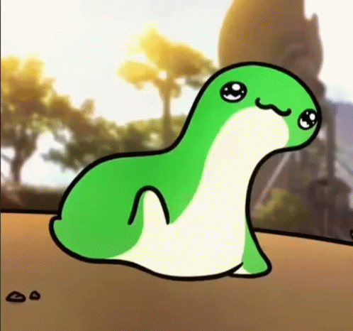 A Green And White Cartoon Frog Is Sitting On Top Of A Sandy Surface . GIF