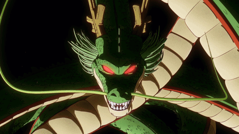 A Green And White Dragon With Red Eyes GIF