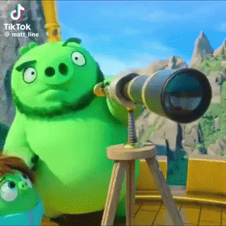 a green angry birds pig is looking through a telescope .