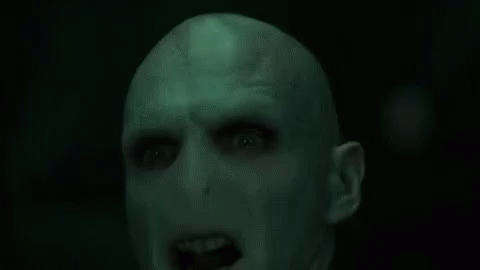 A Green Background With The Words Avada Kedavra Written In White Letters . GIF