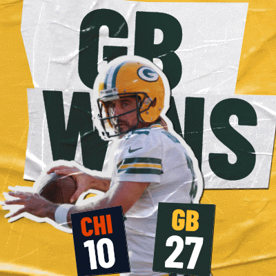 A Green Bay Packers Football Player Is Holding A Ball GIF