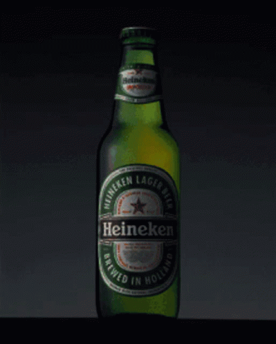 A Green Bottle Of Heineken Lager Beer Brewed In Holland GIF