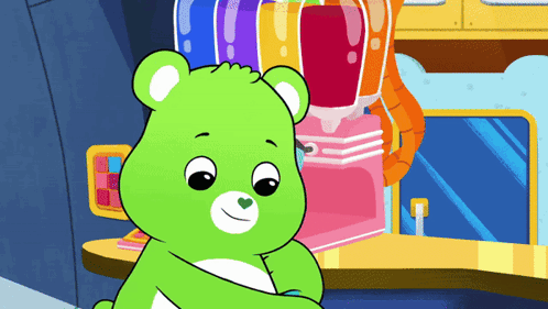 A Green Care Bear Is Sitting In Front Of A Pink Machine GIF