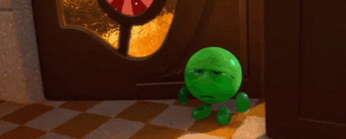 A Green Cartoon Character With A Sad Face Stands In Front Of A Door GIF