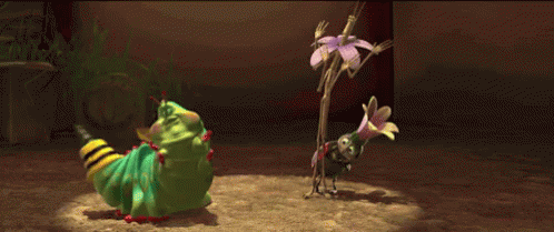 A Green Caterpillar Is Standing Next To A Small Bug GIF