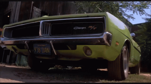 A Green Dodge Charger With A California License Plate GIF