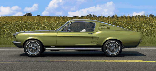 a green ford mustang is parked on the side of the road