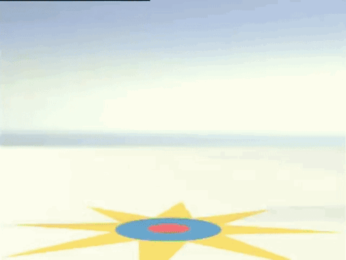A Green Gummy Bear In A Diaper Is Dancing On A Blue And Yellow Circle . GIF