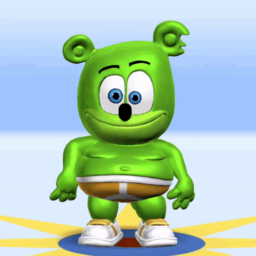 A Green Gummy Bear Is Standing On A Blue Circle GIF