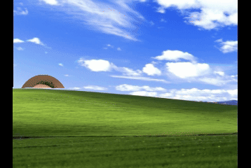 A Green Hill With A Blue Sky And White Clouds GIF