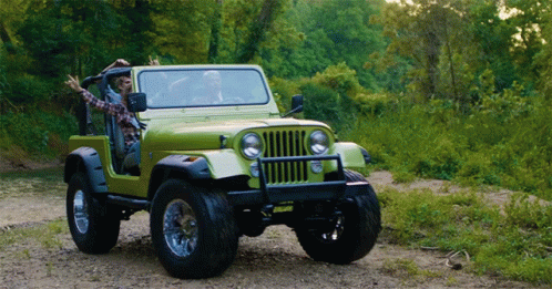 A Green Jeep With A License Plate That Says ' Jeep ' On It GIF