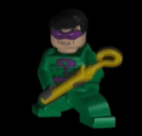 A Green Lego Figure With A Purple Mask And A Yellow Cane GIF