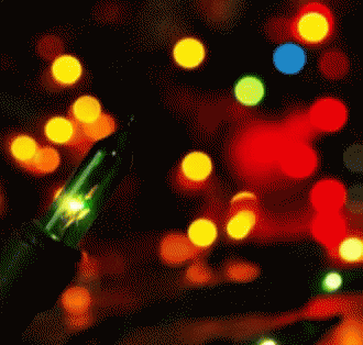 A Green Light Is Lit Up In Front Of A Bunch Of Colorful Lights GIF