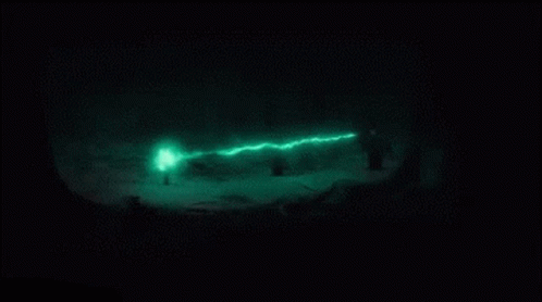 A Green Light Is Shining On A Black Surface GIF