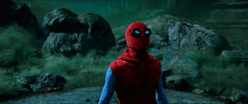 A Green Light Is Shining On A Person In A Dark Room GIF