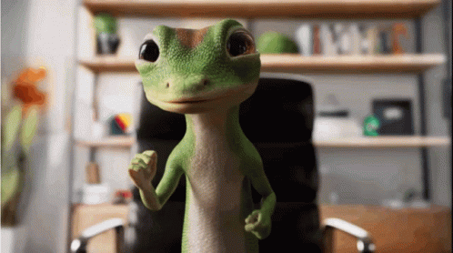 A Green Lizard Is Standing In Front Of A Desk And Chair GIF